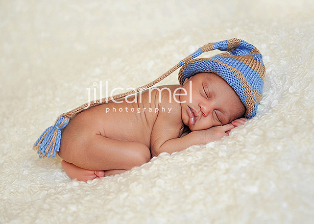 newborn baby with an elf hat