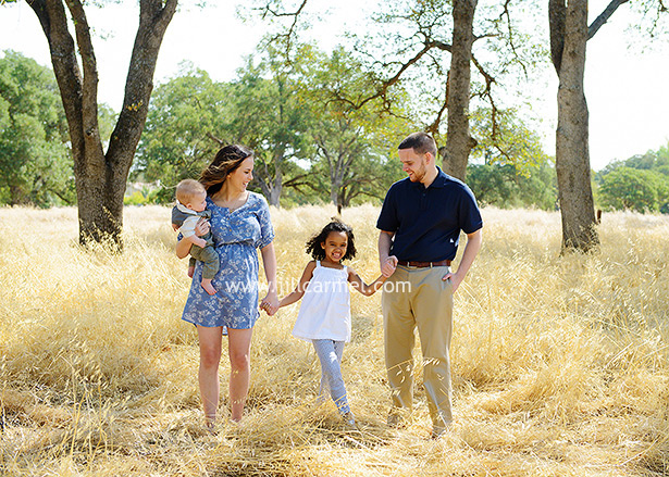 blue and white outfits for fall portraits in sacramento field with oak trees