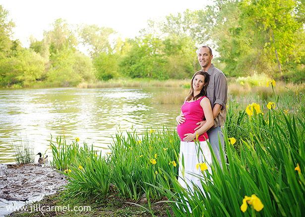 standing by the sacramento pond with yellow irises and ducks for pregnancy pictures