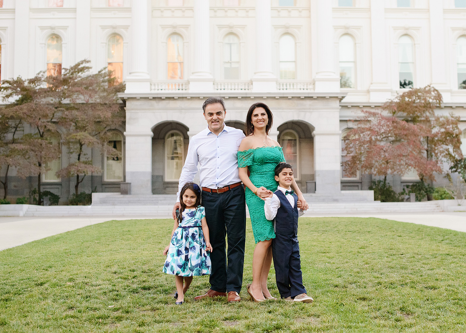 Family photo in front of the lawn at State Capitol