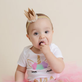 Baby Girl Eating Pink Frosting in Pink Unicorn Tutu Outfit