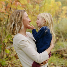 Mom and Daughter Loving Gaze with Tree Background