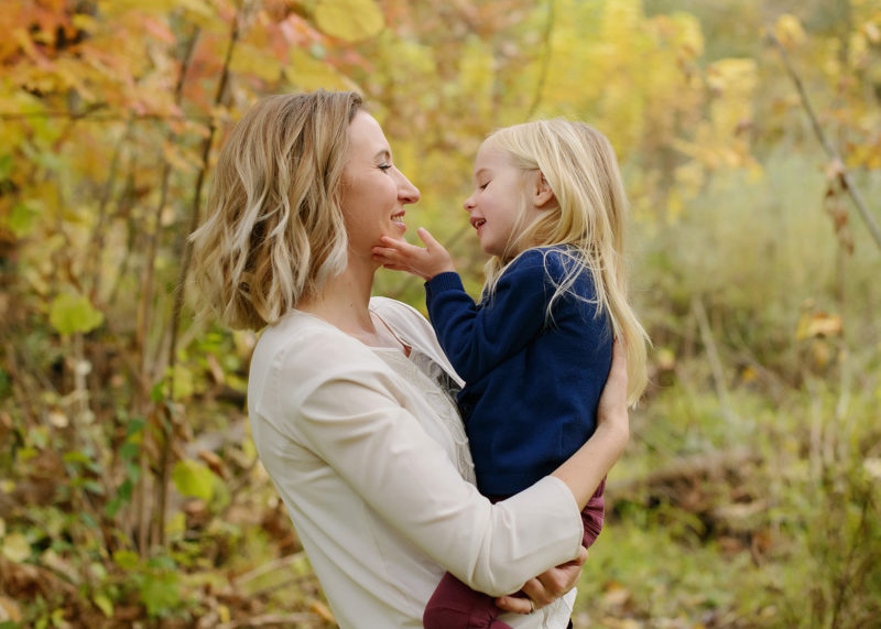 Mom and Daughter Loving Gaze with Tree Background