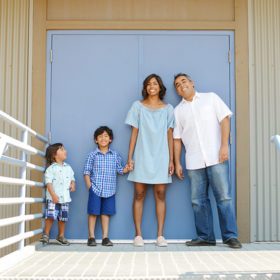 Family Photo in Front of Baby Blue Door in Folsom Powerhouse