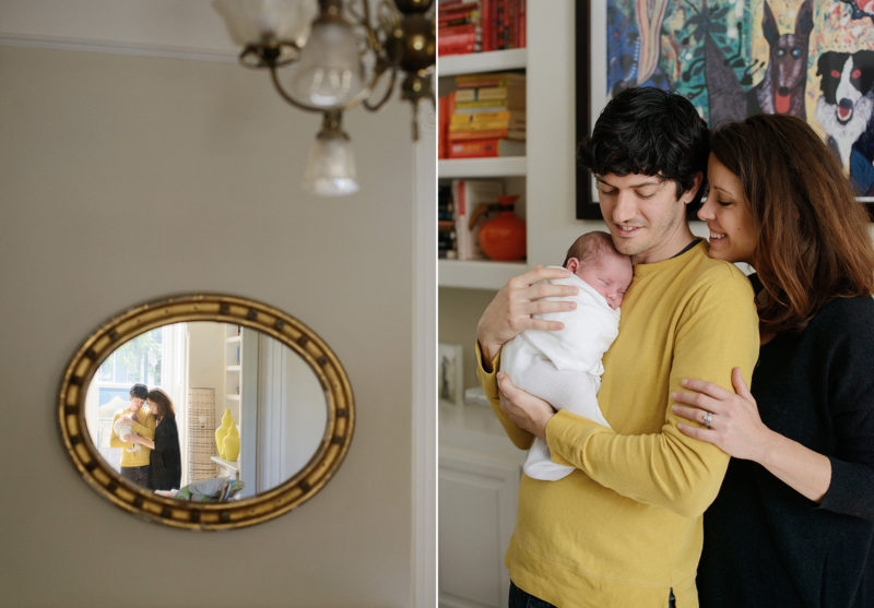 Mom and Dad Hug New Baby Reflection in Mirror