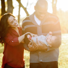 Vince and Sondi Carter Laughing with Baby Boy at Sunset