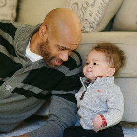 Vince Carter with Baby Boy on Couch