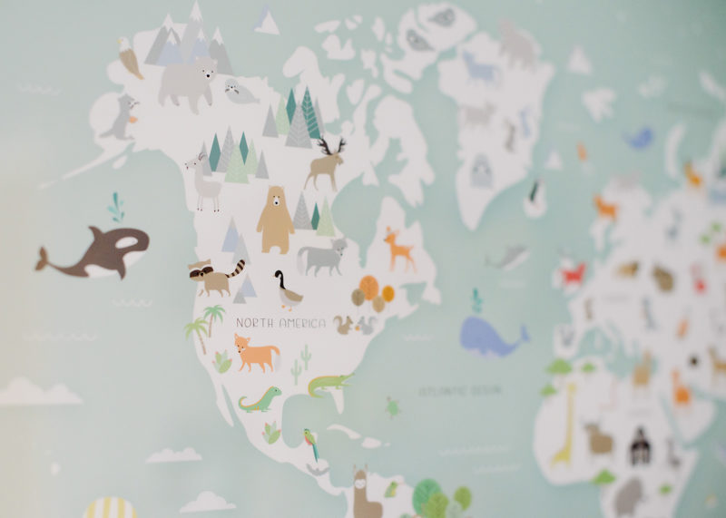 Print detail of map and animals of the world in baby boy nursery