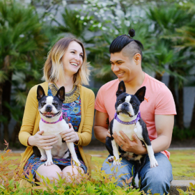 Colorful couple photo with their dogs on the grass at the Sacramento State Capitol