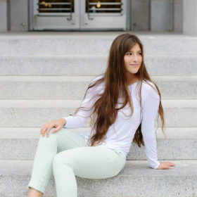 Senior girl in front of steps in Sacramento State Capitol