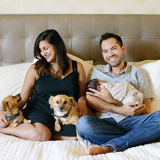 Newborn family photo with the dogs at home in bed in West Sacramento