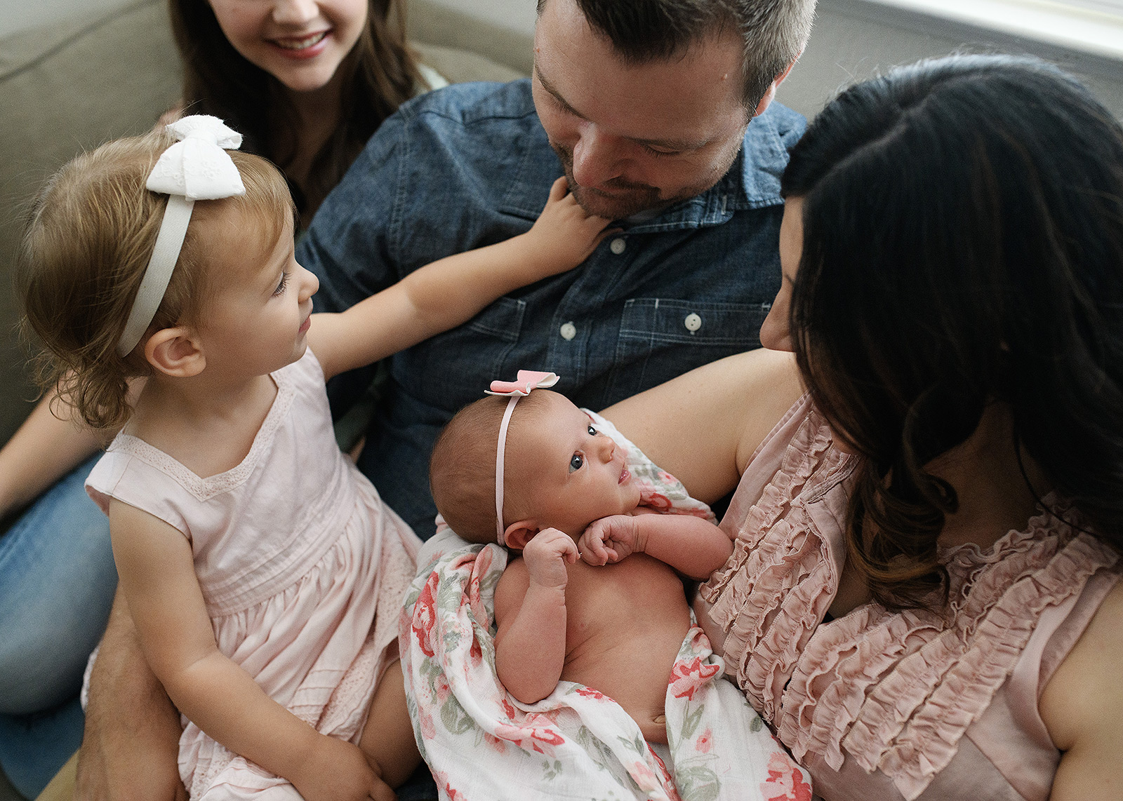Family photos with newborn baby girl in home
