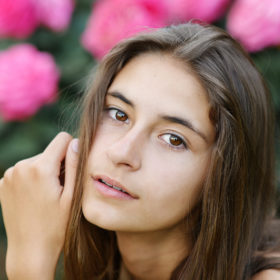 Senior portrait of girl close up with pink flowers in State Capitol