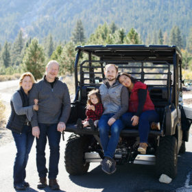Family photo by the jeep outdoors in Nevada fall
