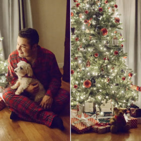 Father and dog snuggling near Christmas tree while daughter reaches for Christmas tree ornament
