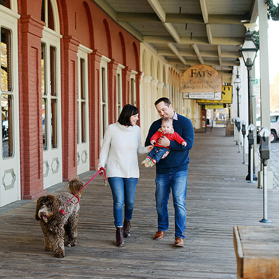 Family walking with dog at Old Town Sacramento