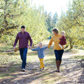 Family photo walking among trees outdoors