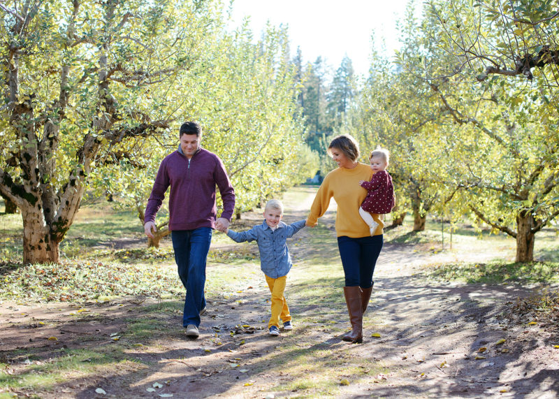 Family photo walking among trees outdoors
