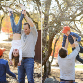 Dad lifting daughter upside down and lifting son in air with Sacramento tree foliage