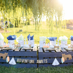 Camping tablescape with teepee gift bags and animal ears