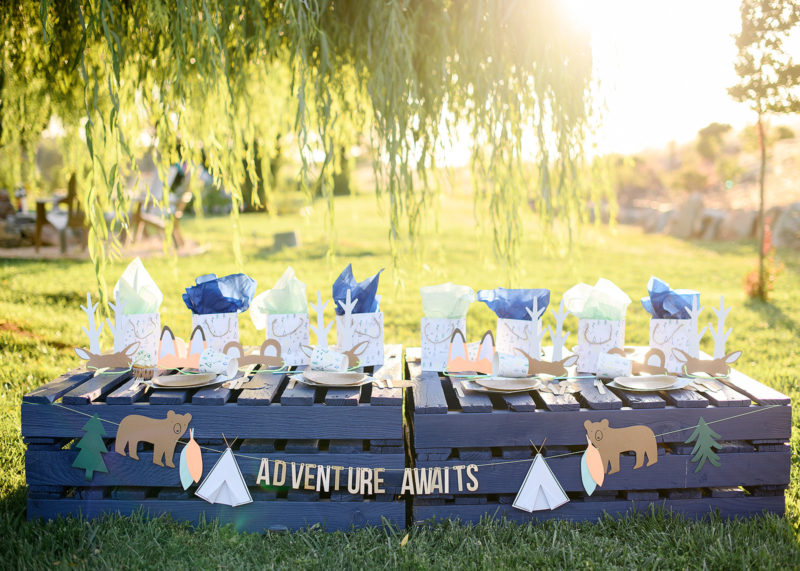 Camping tablescape with teepee gift bags and animal ears