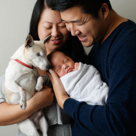 Family portrait with newborn baby and dog in Campbell home
