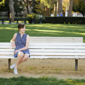 High school senior sitting on bench outside of State Capitol