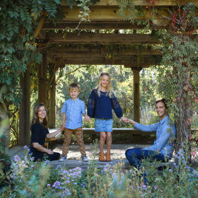 Family photo in gazebo with crawling vines in Quarryhill Botanical Garden Sonoma