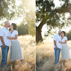 Mom and dad kissing and hugging underneath a large tree in yellow grass in Sacramento