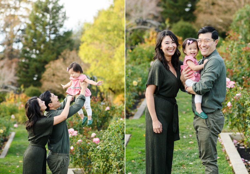Mom and dad lift up baby daughter in the air at McKinley Park Rose Garden