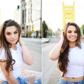 High school senior girl smiling and posing in front of Tower Bridge Sacramento