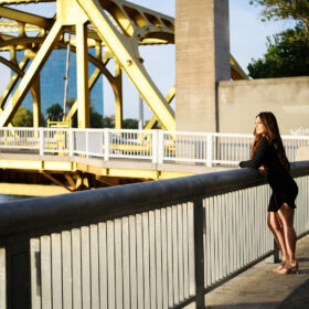 Teen girl looking at the water on Tower Bridge Sacramento