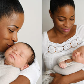 Black mom kissing and holding newborn baby in swaddle in Sacramento studio