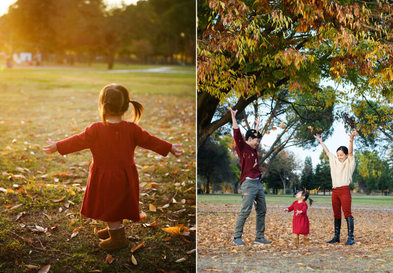 Toddler girl facing the sunset in red dress throwing autumn leaves in Rancho Cordova park Sacramento