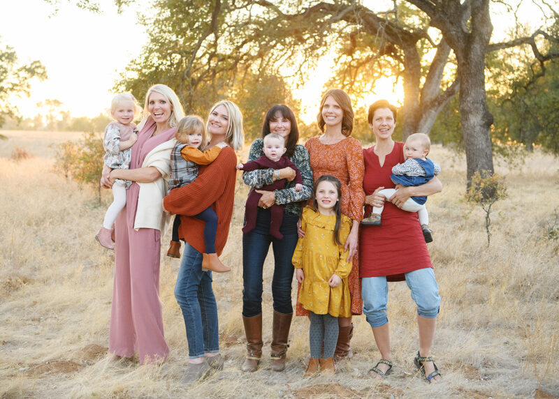 All the women and girls in the family smile for the picture during sunset in Folsom