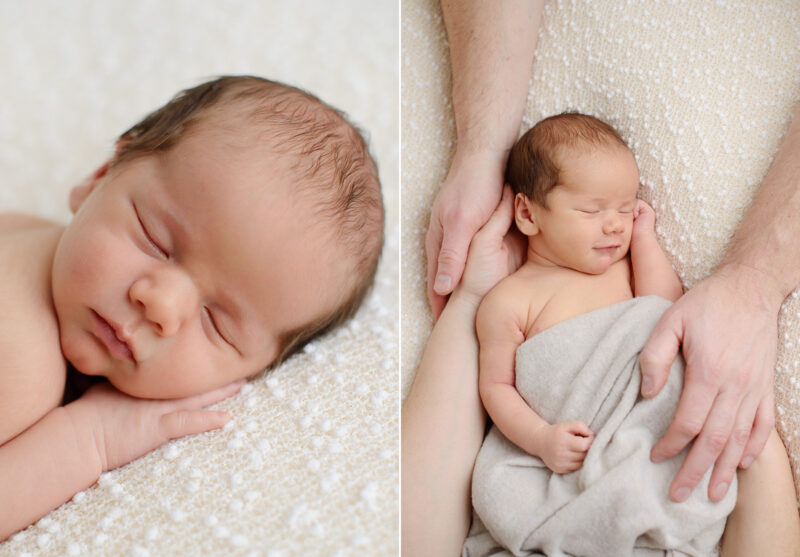 Sleeping newborn baby on white blanket while parents frame his body in Sacramento studio