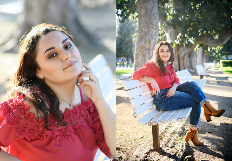 Senior graduate girl sitting on park bench in sun at Sacramento State Capitol