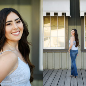 High school senior girl smiling directly at camera in front of Old Sacramento building
