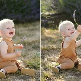 Toddler boy smiling and playing with lavender while sitting on dry grass in Dixon