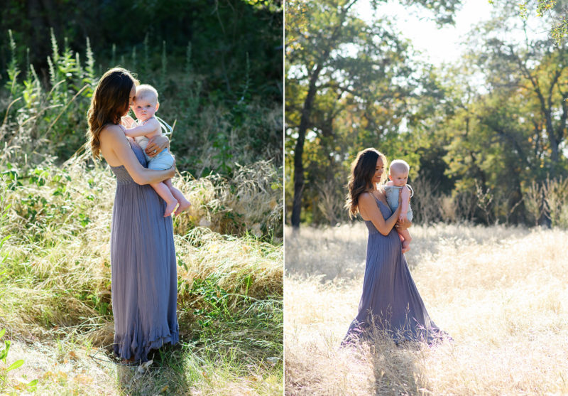 Mom holding baby boy in natural light while standing in dry grass field in Davis