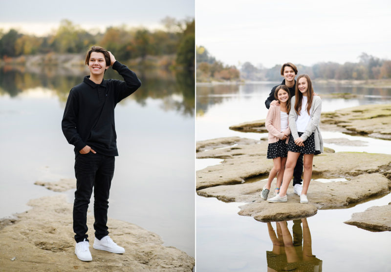 Boy standing by water with hands in hair and sisters standing on rocks by the lake in Sacramento