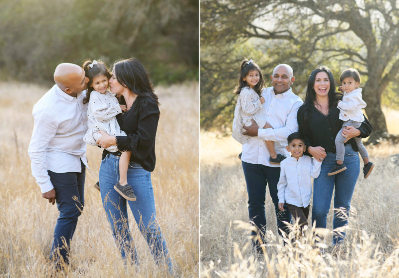 Mom and dad kiss youngest daughter and take a picture with young son in Cameron Park Sacramento