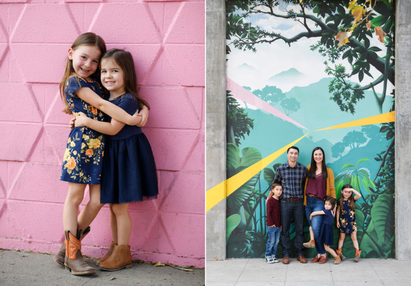 Sisters hugging in front of pink wall and family picture in front of R street corridor mural Sacramento