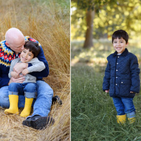 Dad kissing son on cheek while sitting on golden dry grass in Davis Arboretum