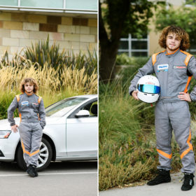 Teen boy in race car driving suit and helmet in front of white car in Sacramento