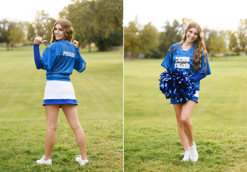 High school senior girl wearing varsity jacket and cheerleading uniform in Sacramento park