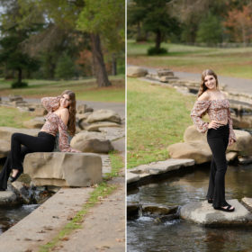 High school senior girl posing by stones near the pond in Sacramento