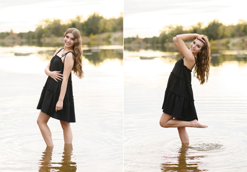 High school senior girl wading in lake water and smiling in Sacramento
