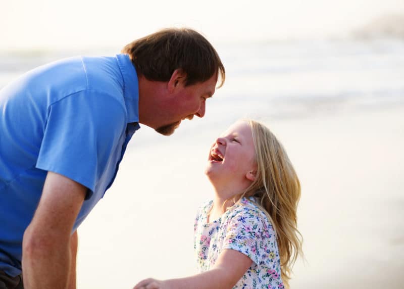 dad and daughter laughing by the ocean dillon beach california