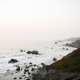 rocks on the ocean during sunset dillon beach california